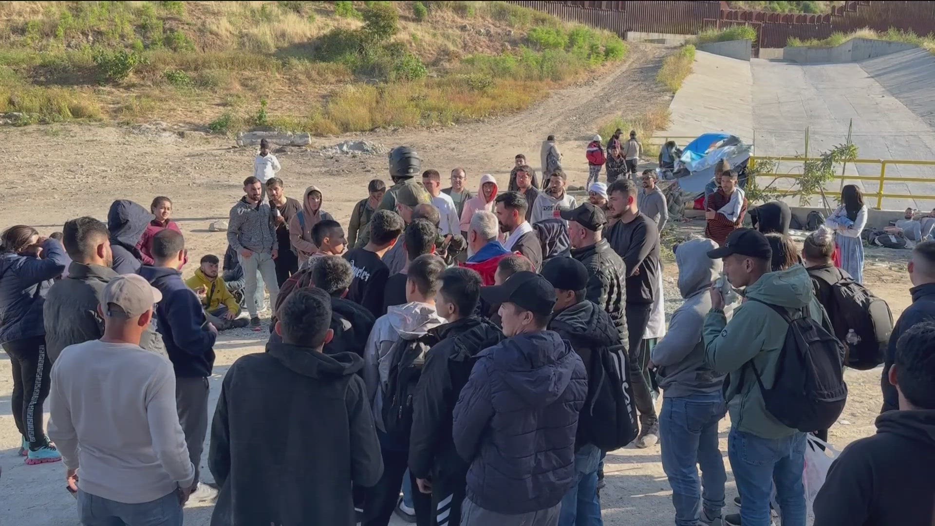 Long lines of migrants wait on the Tijuana-San Diego border as Title 42 ...